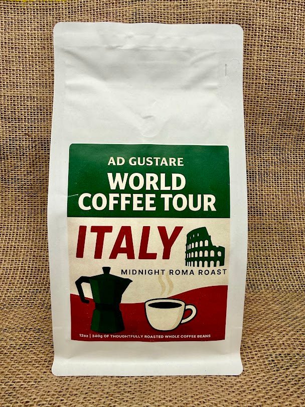 Ad Gustare World Coffee Tour Italy Midnight Roma Roast coffee bag with green, white, and red label featuring a moka pot, espresso cup, and Colosseum illustration, photographed on burlap
